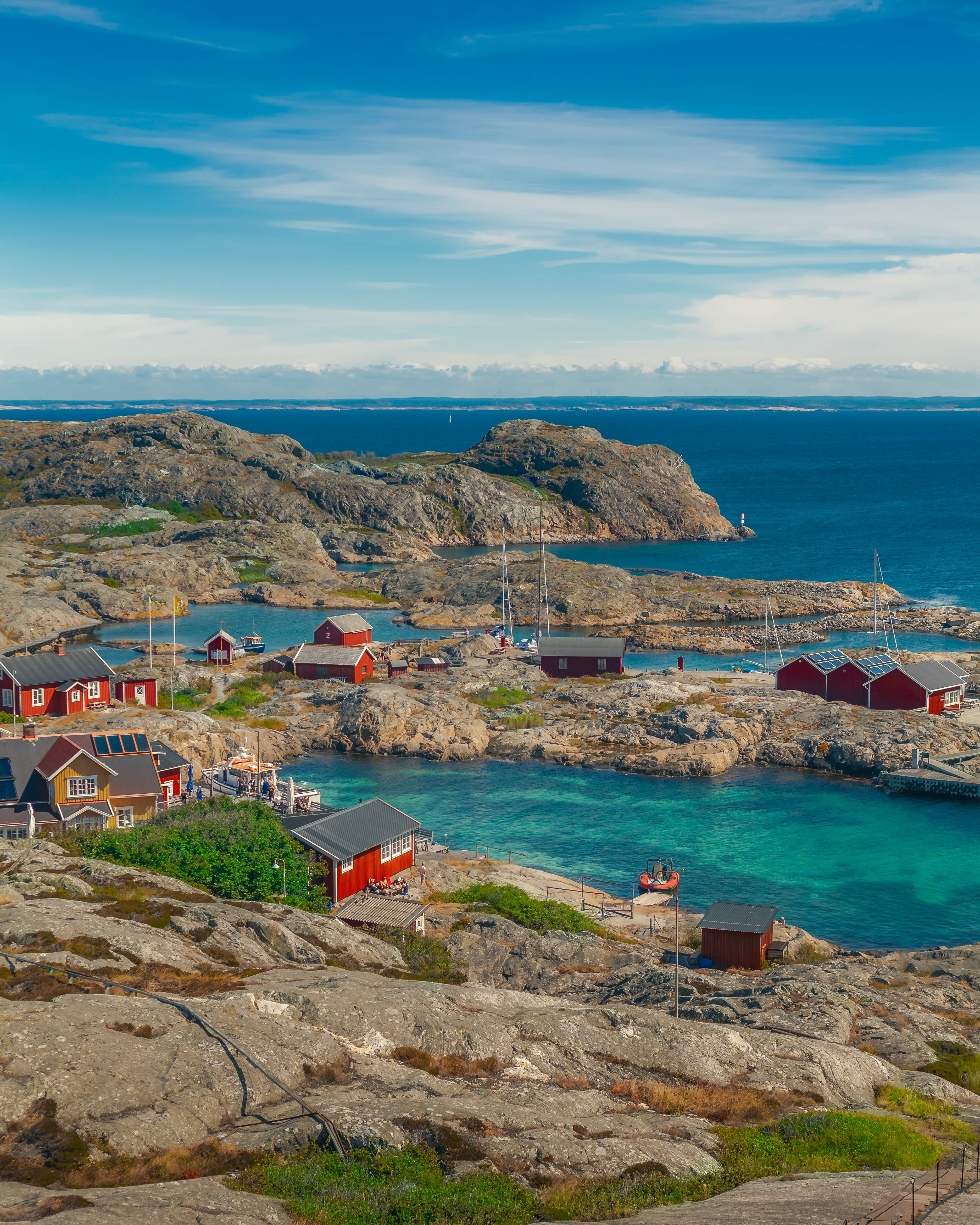Swedish archipelago with red cottages and turquoise water